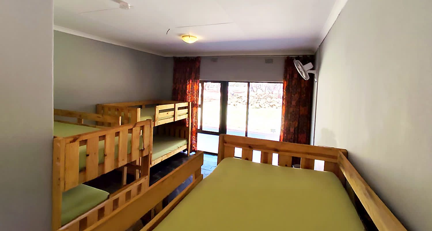 Camper room with bunks and doors to the veranda